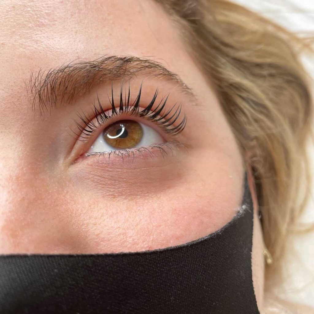 Woman with curled lash lift & tint at Crave Aesthetics in London, Ontario